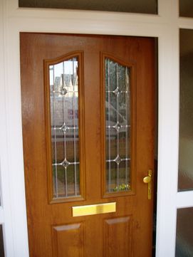 Traditional oak effect composite front door